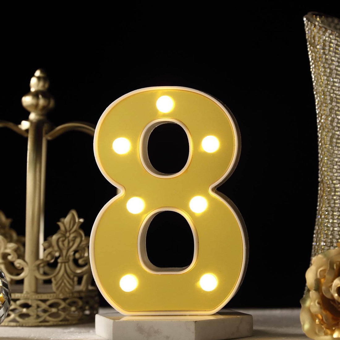 LED marquee number 8 light decoration on a dark background.
