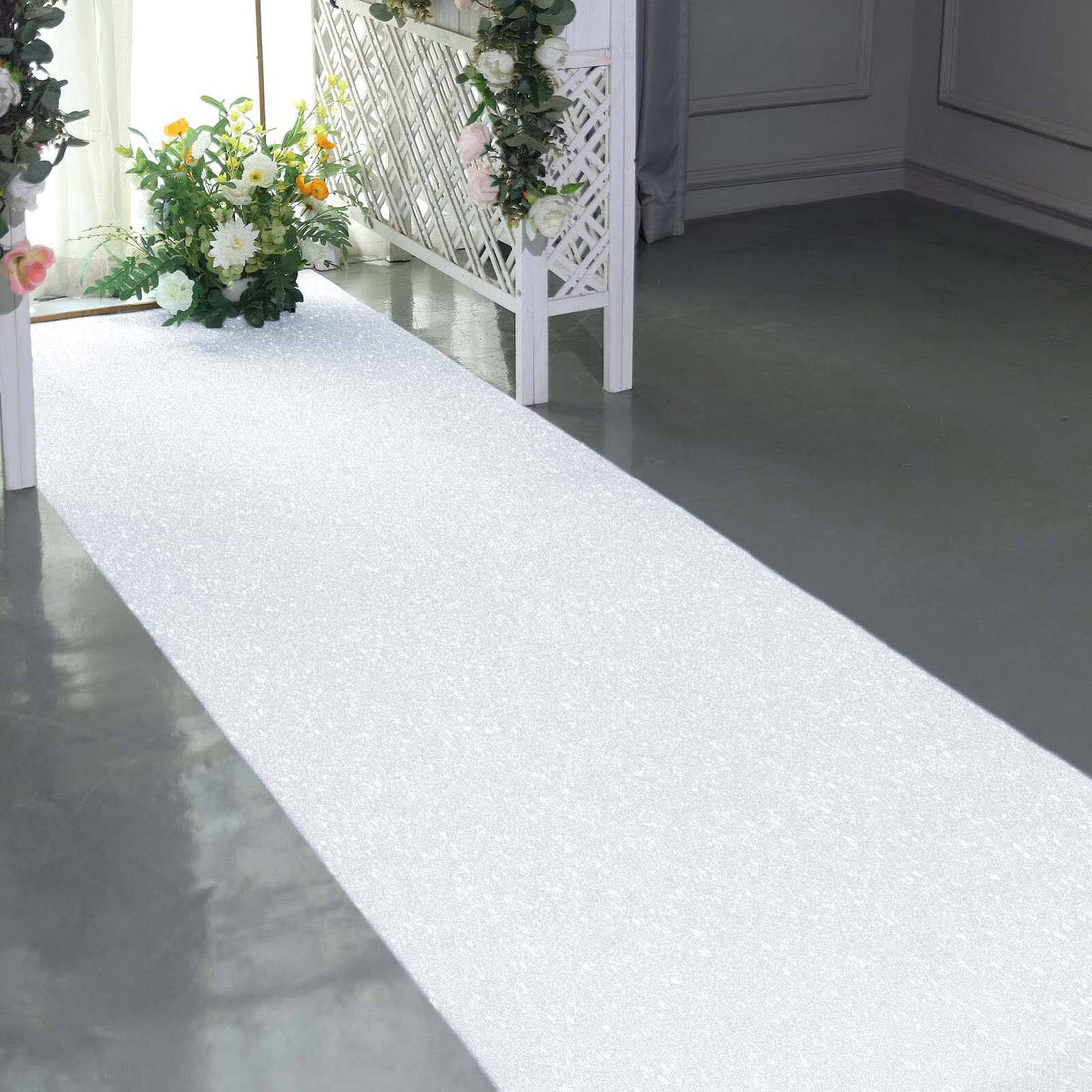 Decorative white aisle runner with sparkles for event decoration.