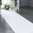 Decorative white aisle runner with sparkles for event decoration.