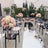 Elegant wedding setup with floral arrangements and mirrored aisle.