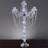 Elegant crystal candelabra with beaded accents and five candle holders.
