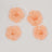 Peach floral embellishments in various sizes on a white background