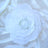White layered flower decoration on silk fabric.