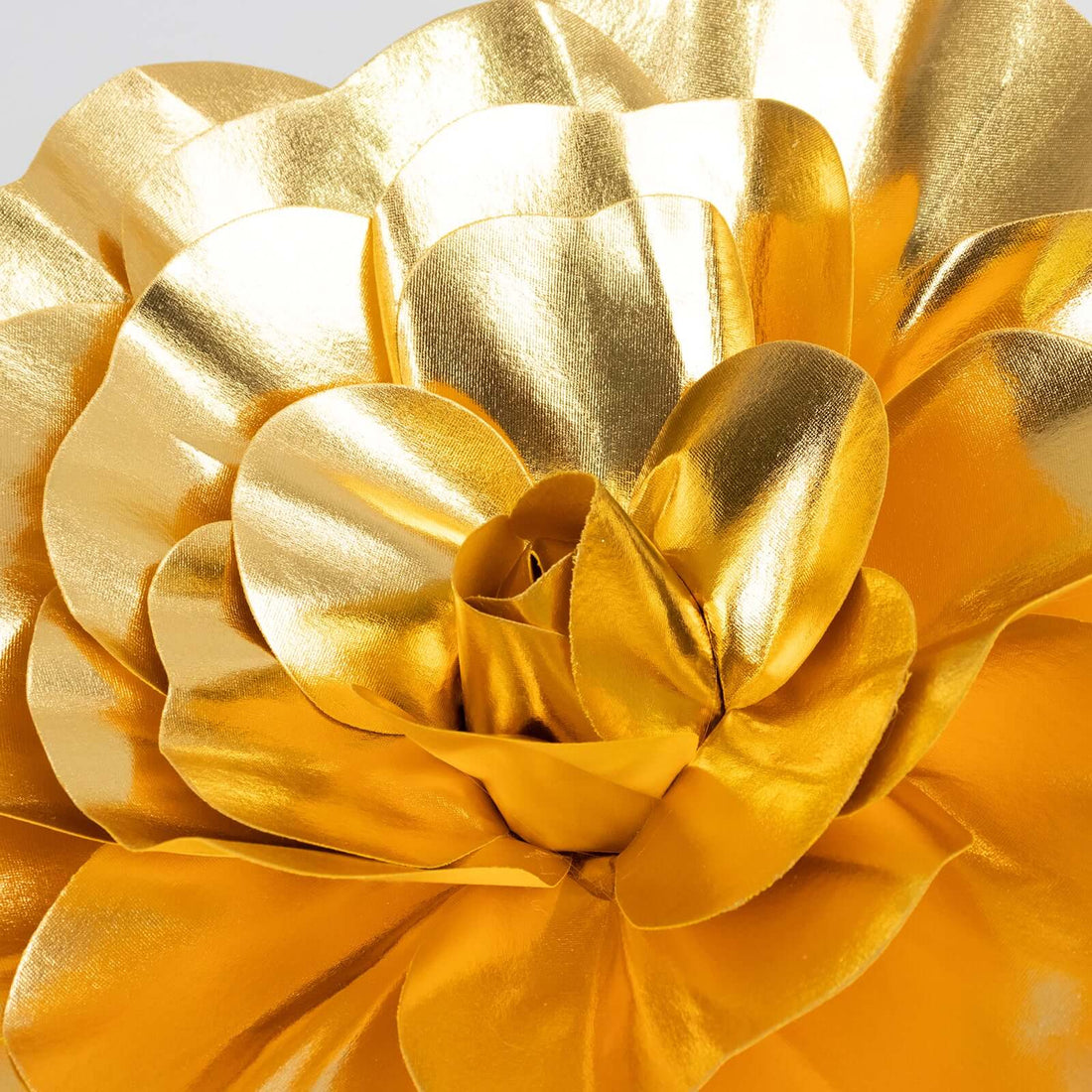 Golden flower decoration with shiny metallic petals.