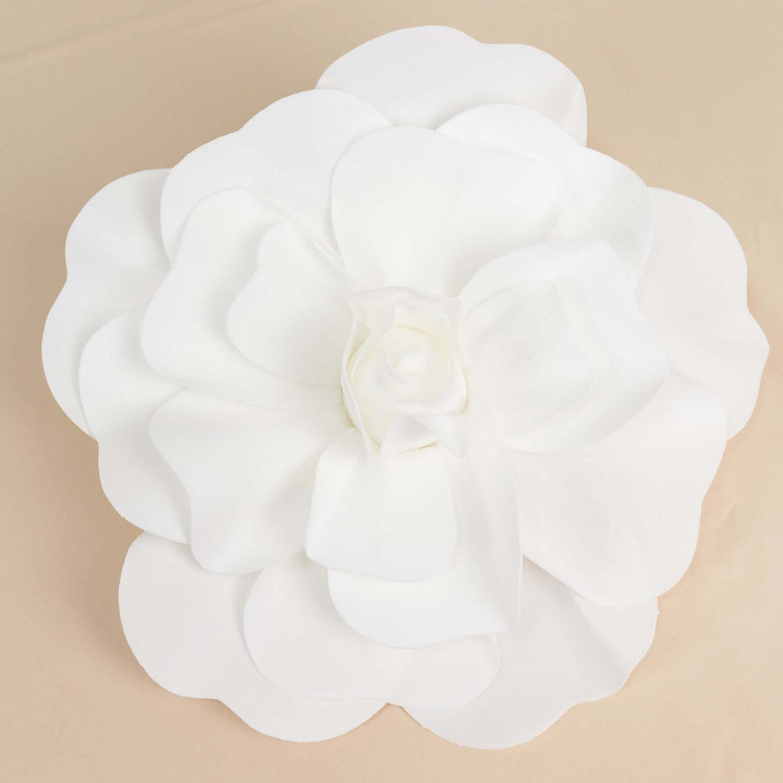 White flower decor piece with layered petals.