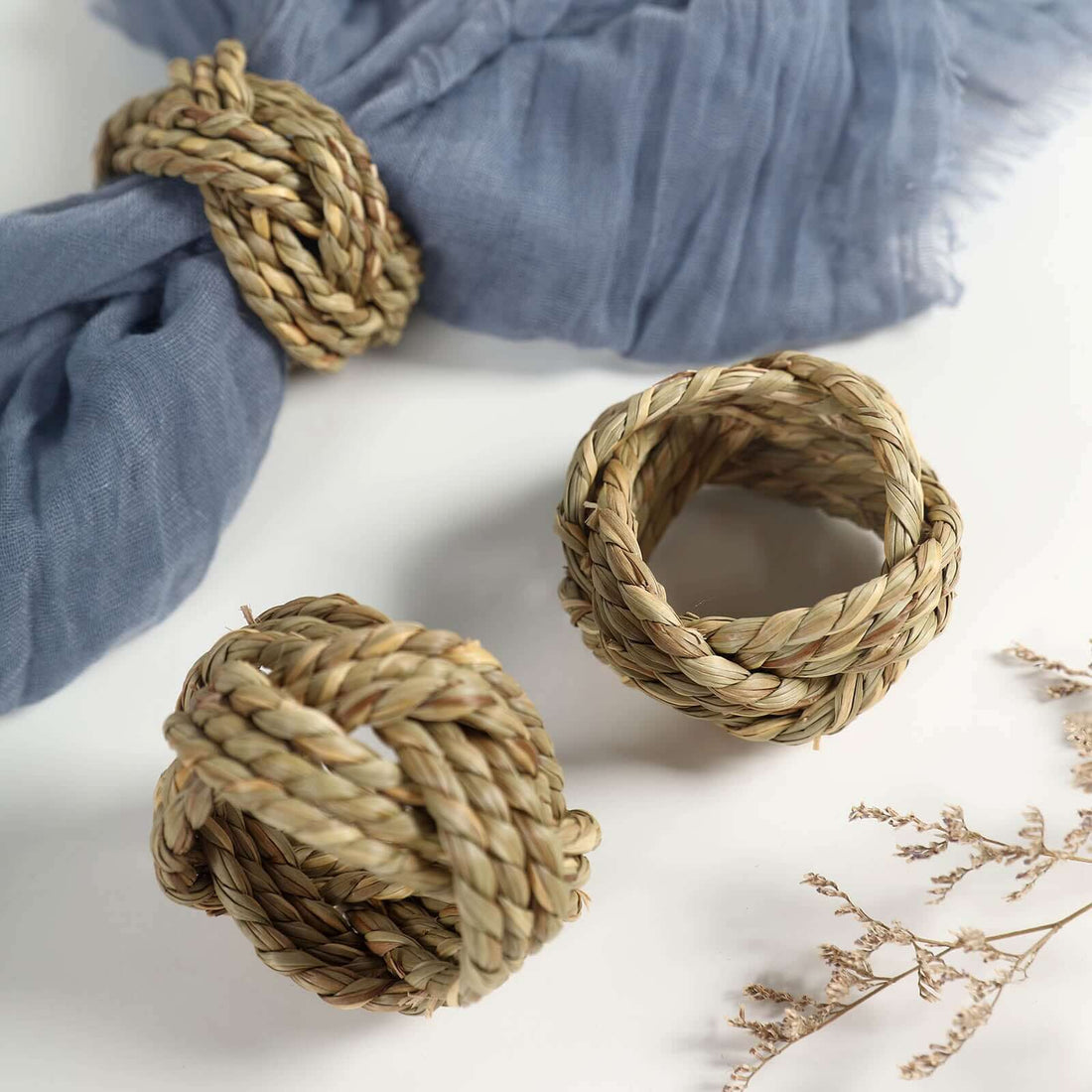 Natural woven napkin rings in a stylish arrangement.