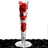 Tall glass vase filled with red and white rose petals