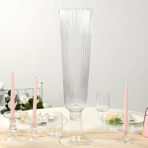Elegant tall glass vase with ribbed design, perfect for floral arrangements.