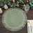 Green woven placemat with fringe detail on rustic wooden table.