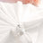 Silver tiara napkin ring on white fabric