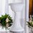 White decorative pedestal with fluted design for floral arrangements