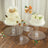 Three clear acrylic cake stands displaying cakes and desserts on a wooden table.
