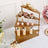 Elegant dessert display stand with assorted treats and cupcakes.