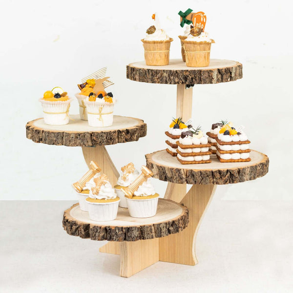 Tiered wooden display stand with assorted decorative cupcakes.