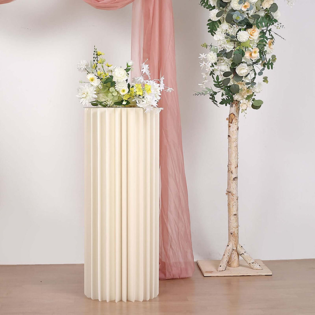 Stylish cream-colored fluted vase with fresh flowers