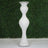 Elegant white decorative vase with crystal accents on a green backdrop.