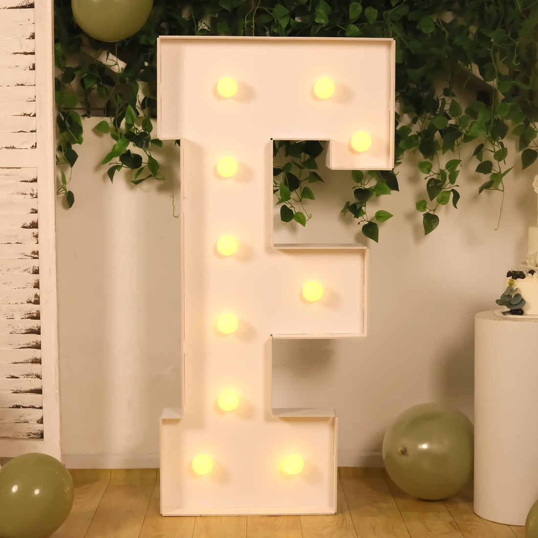 Light-up marquee letter "E" with bulbs, perfect for decor.