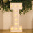 Light-up marquee letter "I" with bulbs on a decorative backdrop.