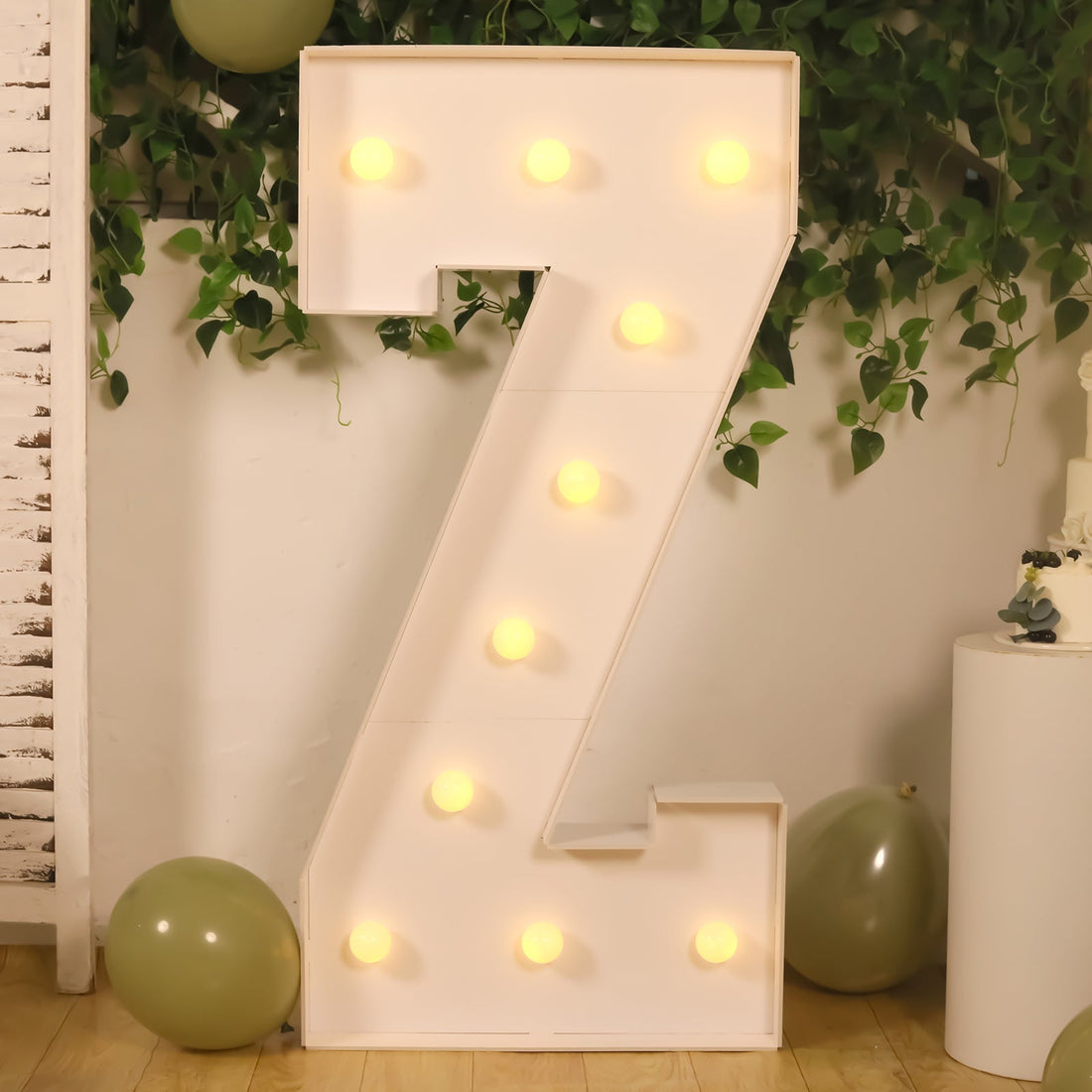 Large illuminated number "7" marquee light with bulbs, perfect for celebrations.