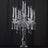 Elegant crystal candelabra with five holders and hanging beads.