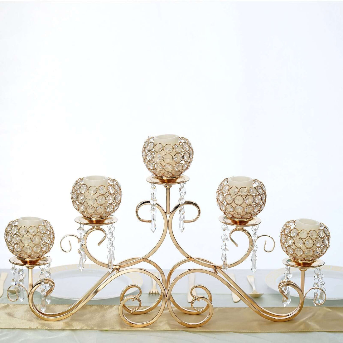 Elegant gold candle holder with crystal accents and five candle cups