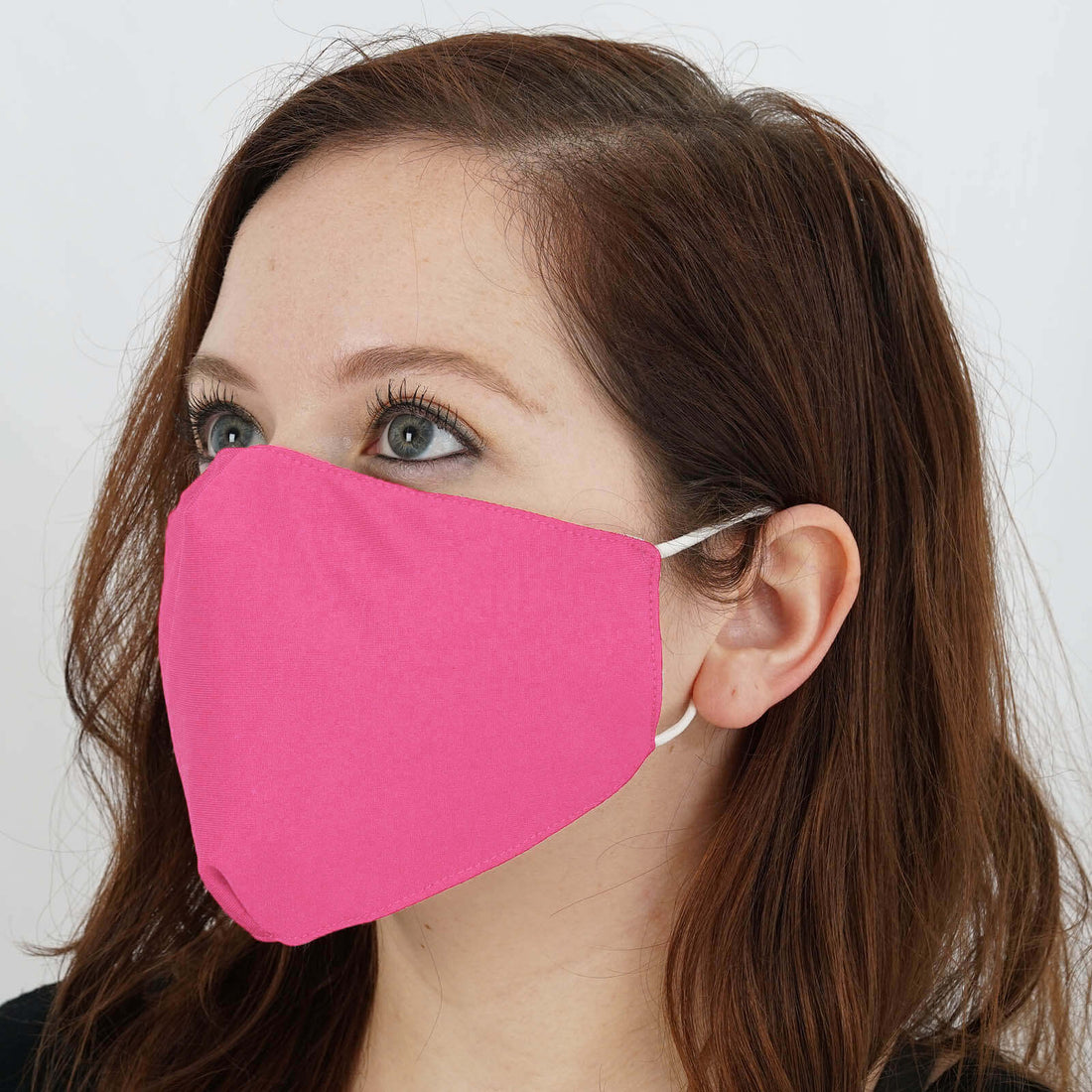 Woman wearing a pink fabric face mask.