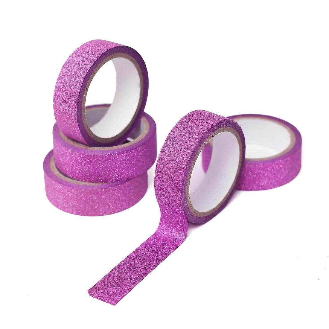 Glitter pink washi tape rolls stacked and unrolled on a white background.