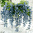 Blue flower bouquet in a clear vase, elegantly arranged for a table setting.