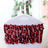 Red sequin chair sash draped over a white chair for festive decor.