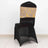 Black chair with a gold patterned backrest on a plain background.