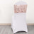White chair cover with rose gold sequin sash, perfect for events and weddings.