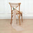 Neutral linen chair tie with white flower decoration on a wooden chair.