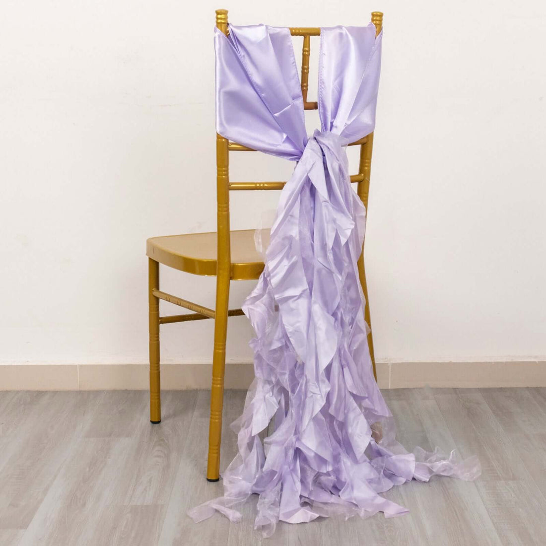 Lavender chair sash with ruffled design draped on a gold chair.