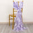 Lavender chair sash with ruffled design draped on a gold chair.