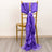 Purple satin chair sash draped elegantly over a gold chair.