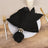 Elegant black napkin with silver ring on a white plate.