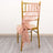 Peach tulle chair sash draped on a gold chiavari chair