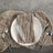 Elegant table setting with textured linen, plate, and silverware.