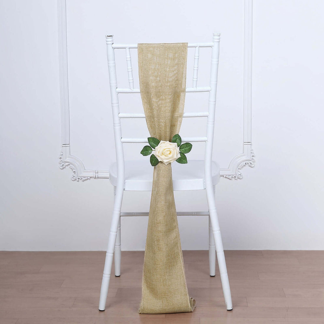 Chair with beige sash and white rose decoration