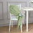 Green linen chair sash with a floral accent on a white chair.