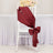 Burgundy satin chair sash tied in a bow for events and decorations.