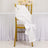 White satin chair sash tied in a bow on a gold chair.