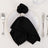 Elegant black napkin elegantly styled on a white plate with silver napkin ring.