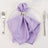Lavender satin napkin elegantly styled on a white plate with silver ring.
