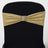 Gold sequin chair sash with rhinestone buckle on a black chair.