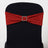 Red glitter chair sash with rhinestone buckle on a black chair.