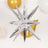 Silver star-shaped balloon decoration for festive events.