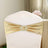 Gold chair sash with a rhinestone buckle, elegantly draped on a light-colored chair.