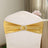 Gold chair sash with rhinestone buckle on a white chair.