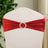 Red satin chair sash with rhinestone buckle for elegant decor.